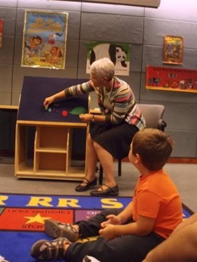 librarian using felt board for reading the book